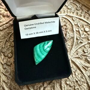 Genuine undrilled malachite gemstone
